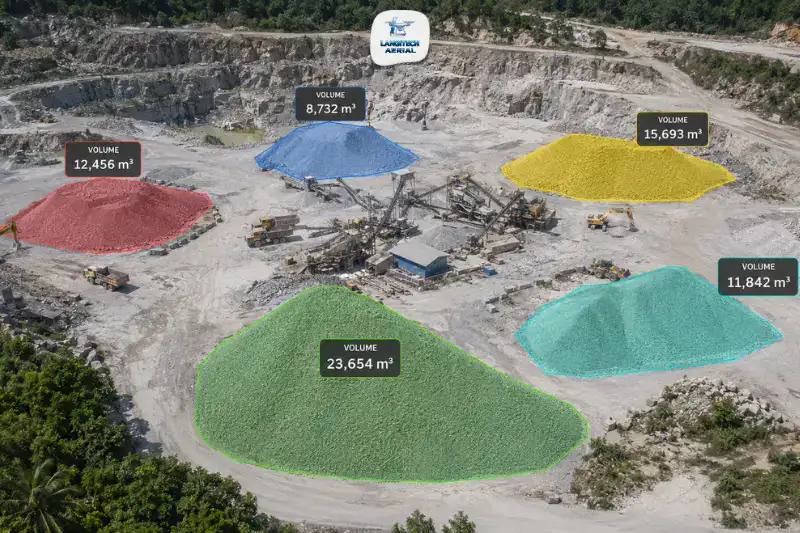 Aerial drone view of a Malaysian quarry with stockpile volume measurements overlaid on material stockpiles